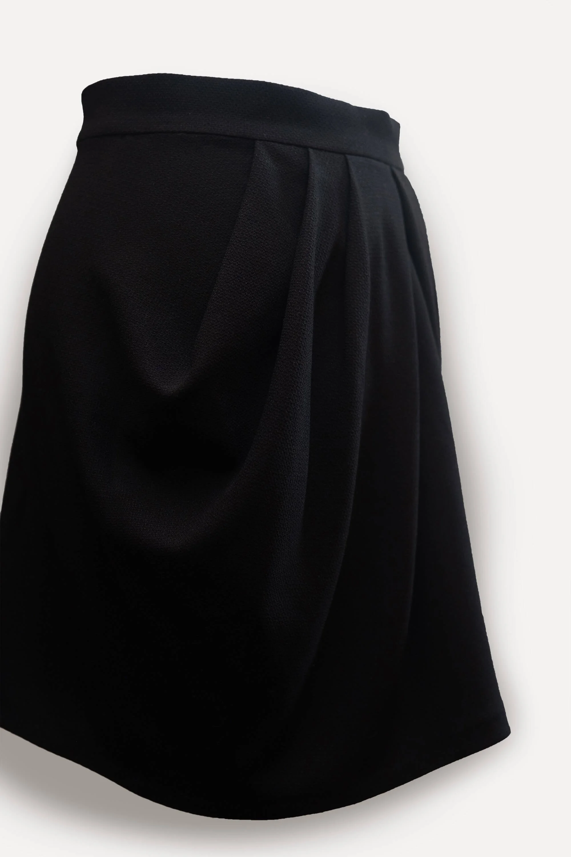 Short draped black shop skirt